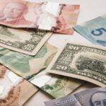 a pile of canadian money sitting on top of a table
