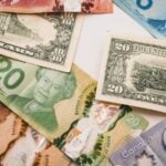 a bunch of different bills laying on top of each other