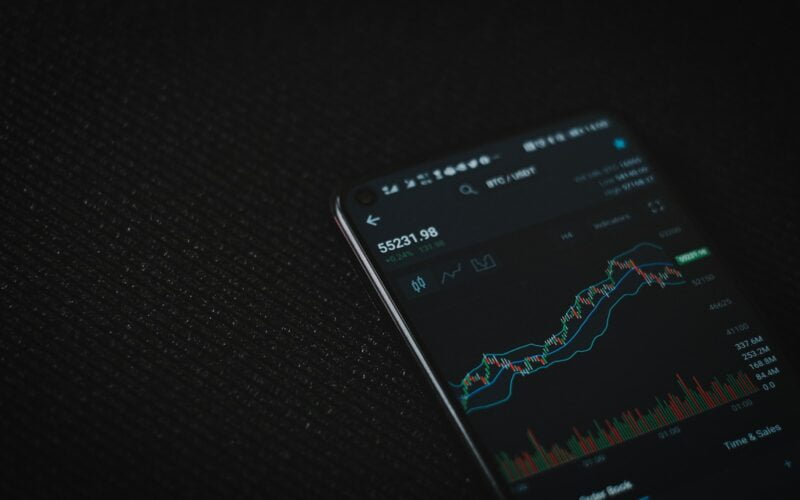 black android smartphone on black textile