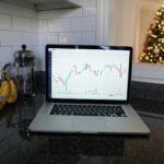 macbook pro on black table