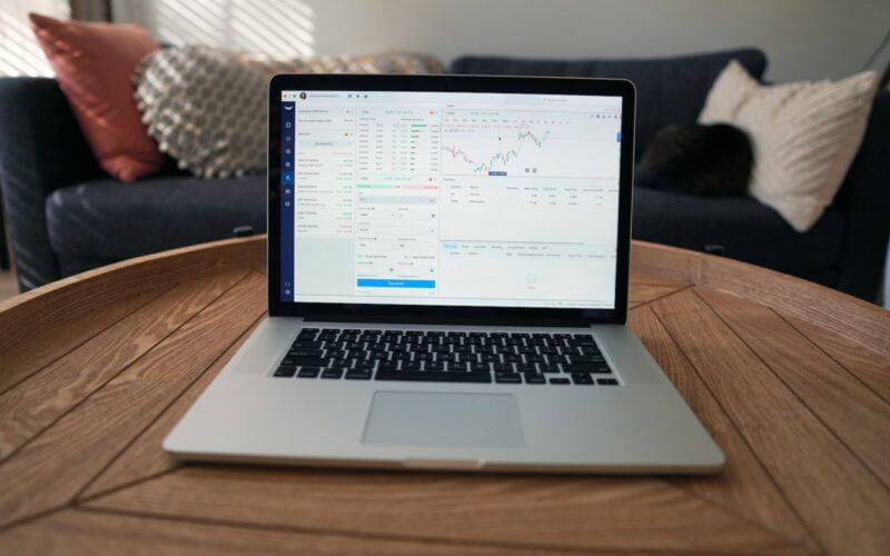 macbook pro on brown wooden table