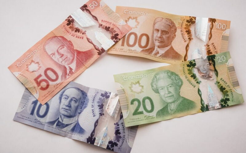 a group of five different bills sitting on top of each other